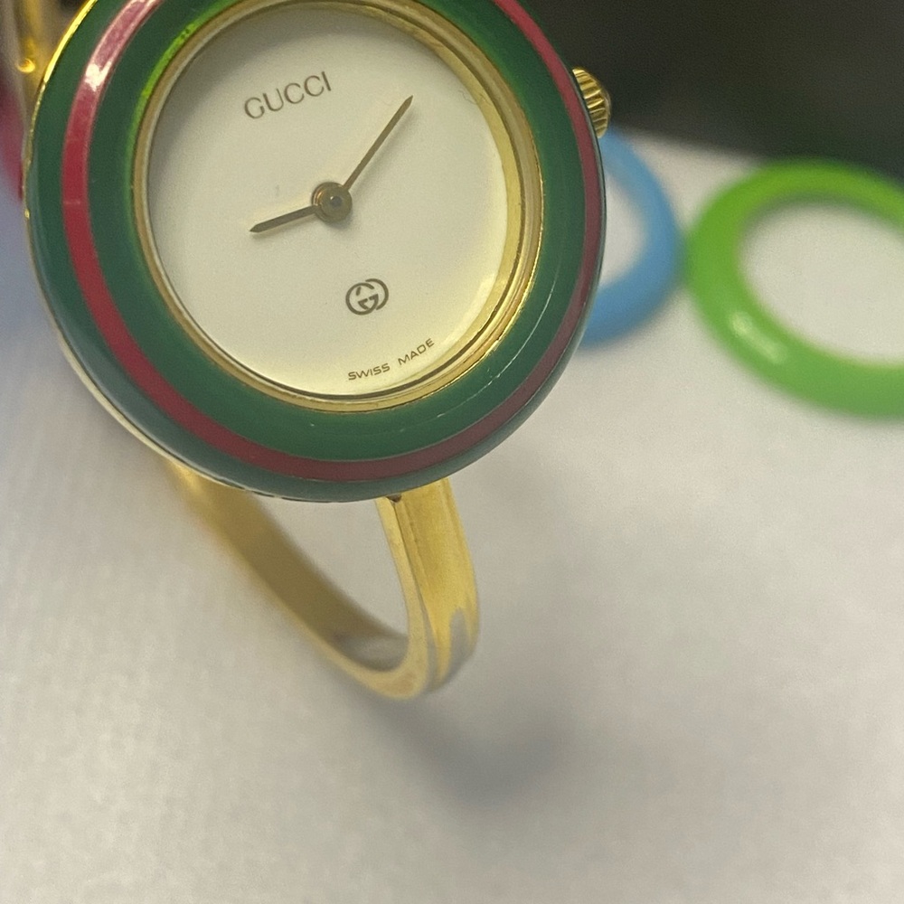 Gucci Gold Watch with Green and Red Accents
Size 6.5" adjustable